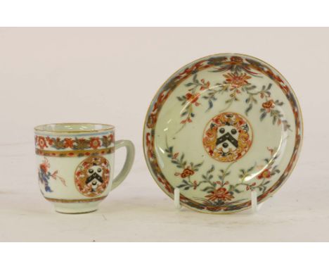 A CHINESE IMARI ARMORIAL COFFEE CUP AND SAUCER (2)Kangxi, circa 1712
Painted with the arms of Walker inside a border of leafy