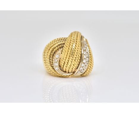 A GOLD AND DIAMOND RING IN A BOMBE WIREWORK DESIGNMounted with circular cut diamonds, detailed 750, ring size J, gross weight