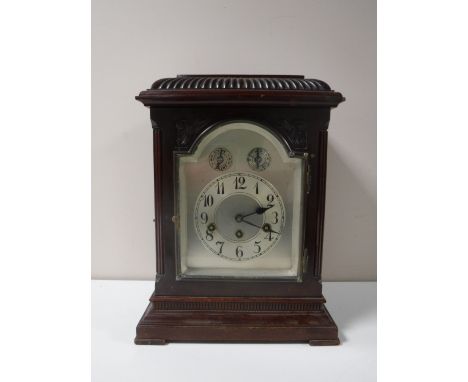 An early 20th century German bracket clock with pendulum and key. 
