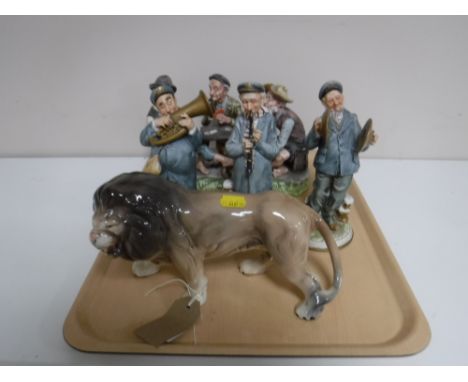 A tray of Melba ware lion figure together with four continental pottery figures; three band members and a group 'The Card Pla