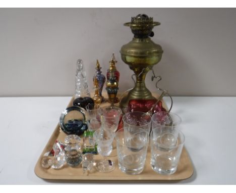 A tray of brass oil lamp base, assorted glass ware, decanters, paperweights etc 