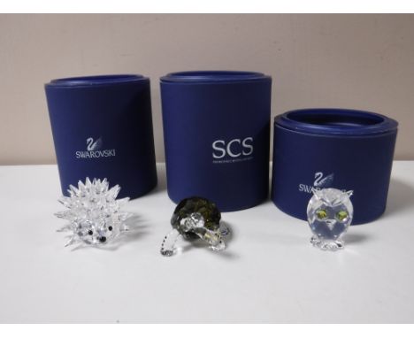 Three boxed Swarovski Crystal animals - hedgehog, owl and tortoise 