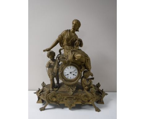 A gilt metal 8 day figural mantel clock with enamel dial, height 55cm.