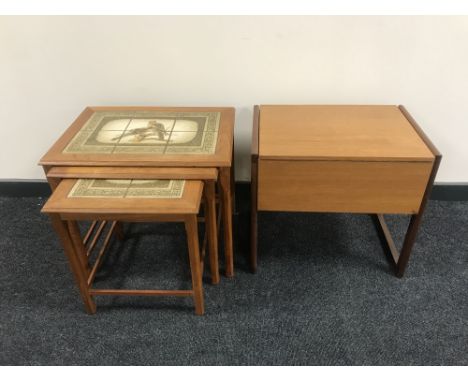 A nest of three teak Danish tile top tables together with a teak storage sewing box