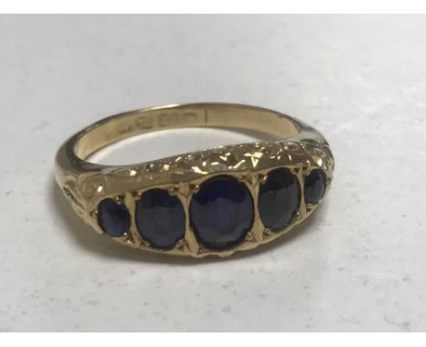 An 18ct gold five stone sapphire ring, size K, 2.9g.