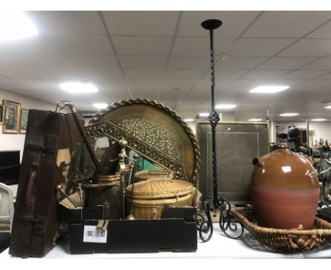 A vintage luggage case and a box of brass charger, brass framed mirror, copper coal bucket, companion set, wicker baskets, ca