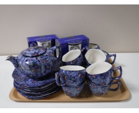 A twenty seven piece Ringtons chintz pattern tea service and two boxed Ringtons commemorative mugs  