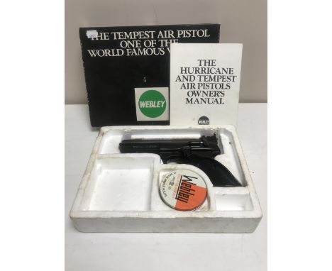 A boxed Webley Tempest air pistol with instruction manual and a tin of pellets 