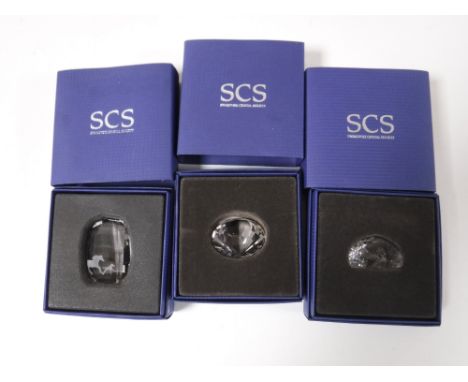 Two boxed Swarovski Crystal paperweights and a  Swarovski Crystal prism 