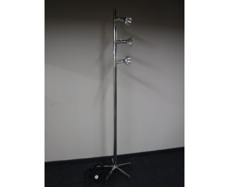 A three lamp track light on five way stand 
