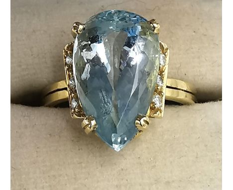 A boxed 18ct yellow gold aquamarine and diamond dress ring by Amsterdam Sauer, set with a drop shape mixed cut aquamarine wit