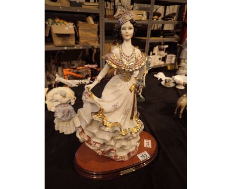 Large ceramic figurine of a Spanish dancer on wooden base