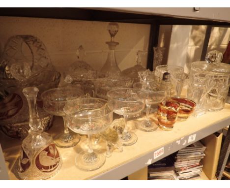 Shelf of glassware and cut glass containers baskets bowls barrels etc