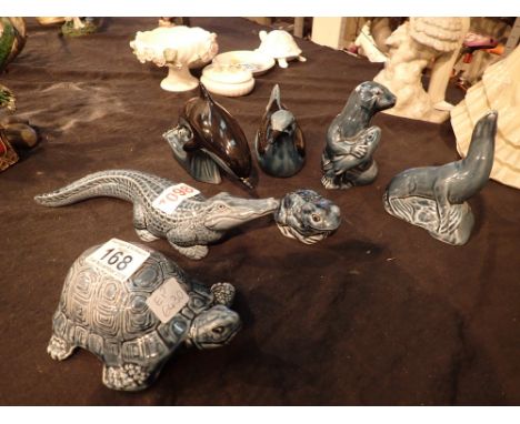 Seven pieces of blue Poole Pottery tortoise alligator seal frog dolphin seagull potter