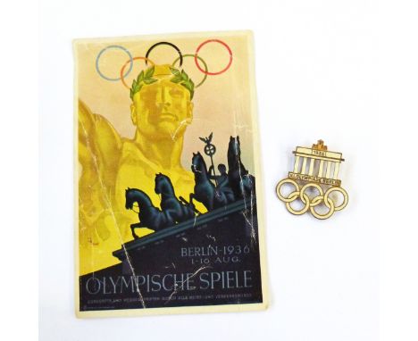 German enamelled gilt metal badge commemorating the 1936 Berlin Olympics, modelled with the five interlocking Olympic rings, 