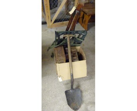 3 ammunition boxes, a belt of linked de-activated cartridges, a post war load carrying frame, a 1943 GS shovel, a camp bed, a