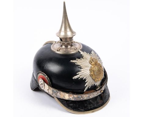 An Imperial German Saxony officials pickelhaube, with star plate and white metal mounts, including spike with perlring, base 