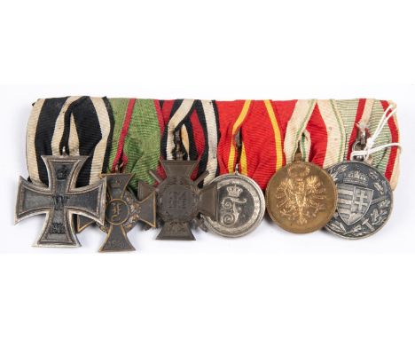 A group of six German medals: 1914 Iron Cross 2nd Class, Anhalt Friedrich Cross, 1914-18 Honour Cross with swords, Baden 9 ye