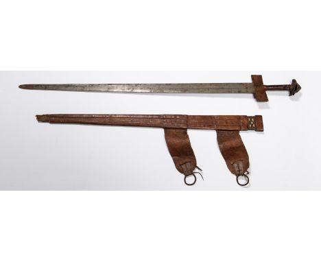 A Tuareg sword, tapered DE blade 31½", etched with scrolled decoration, cruciform hilt with leather covered crosspiece and gr