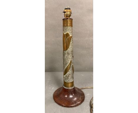 A wooden based table lamp with tulip hammered brass column 