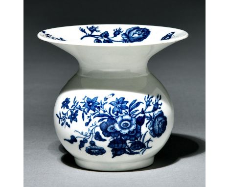 A Worcester spittoon, c1775, transfer printed in underglaze blue with the Three Flowers pattern, 9.5cm h, hatched crescent   