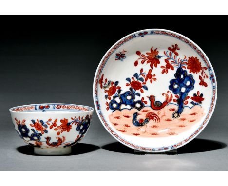A Lowestoft tea bowl and saucer, c1775, painted in underglaze blue and overglaze enamel colours with the Redgrave Two-Bird pa