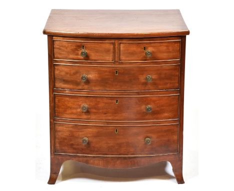 An early Victorian bow fronted mahogany commode chest, with hinged front and dummy drawers, 71cm h; 53 x 64cm  Provenance: H 