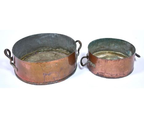 A Victorian copper round pan, with brass handles engraved BELL.T.H, 14cm high, 45cm diameter and a contemporary two handled c