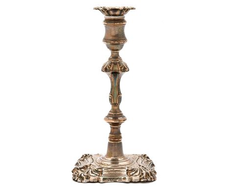 A William IV silver candlestick, with shell cornered nozzle and foot, waisted sconce and knopped pillar, 23cm h, by T J &amp;