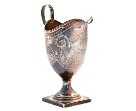 A George III helmet shaped silver cream jug, engraved with festoons, on square foot, crested, 14cm h, maker's mark rubbed, Lo