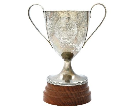 A George III shield shaped silver cup, with reeded handles and foot, bright cut with oval reserve inscribed Mr Barnes &amp; M