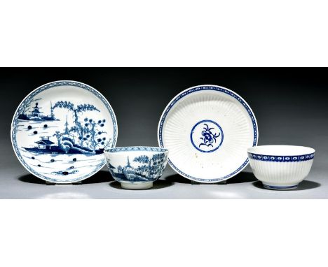A Worcester tea bowl and saucer and a reeded example, c1770, painted in underglaze blue with the Cannonball or Diaper Border 