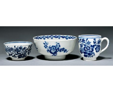 A Worcester bowl, coffee cup and tea bowl, c1780, transfer printed in underglaze blue with the Three Flowers or Fruit and Wre