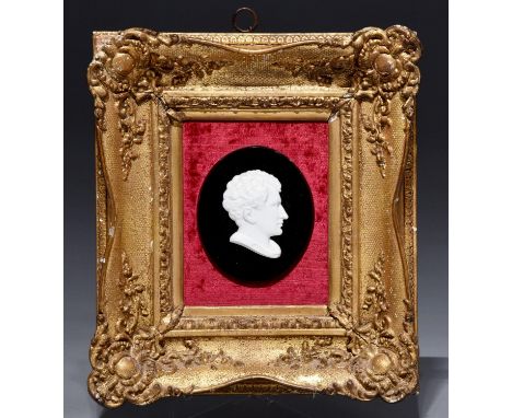 A biscuit porcelain bas relief portrait of Lord Byron, 19th century, on oval black glass mount, 109 x 50mm, framed  Provenanc