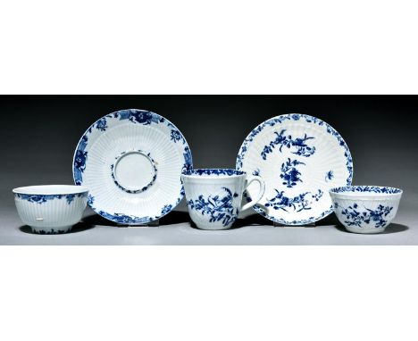 A Worcester feather moulded trio and reeded tea bowl and socketed saucer, c1760, painted in underglaze blue with the Feather 