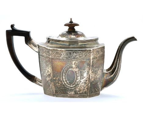 A George III silver teapot, octagonal, the domed oval lid with integral hinge, engraved in neo classical style with border of