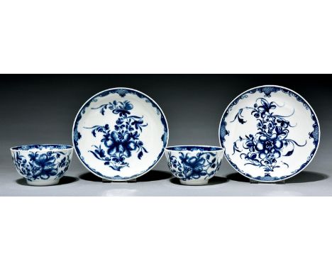 Two Worcester tea bowls and saucers, c1770, painted in underglaze blue with the Mansfield pattern, saucers 12cm diam, crescen