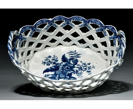 A Caughley basket, c1785, of the large size and oval open trellis form, painted and transfer printed in underglaze blue with 