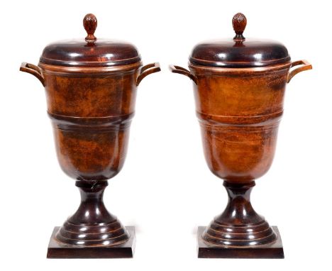 A pair of patinated metal urns and covers, 20th century, mottled light and dark brown patina, 35cm high    Good condition