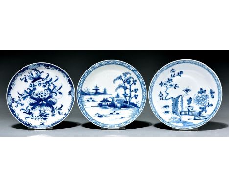 Two Worcester saucers and a Bow saucer, c1760 and c1765, painted in underglaze blue with the Cannonball, Zig-Zag Fence or Man