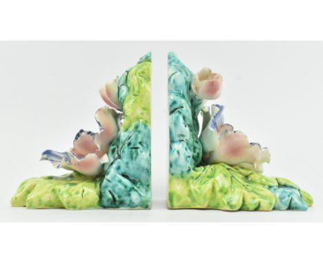 A pair of Italian mid century porcelain faience - majolica style bookends of floral encrusted design. Colourful flowers raise