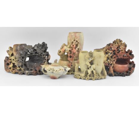 A collection of five 20th century Chinese soapstone carvings. The lot to include three carvings depicting tree &amp; flowers.