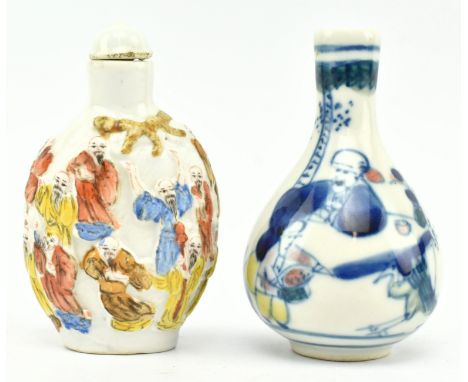 Two 20th century Chinese ceramic snuff bottles. The lot to include a famille rose snuff bottle decorated with relief figurine