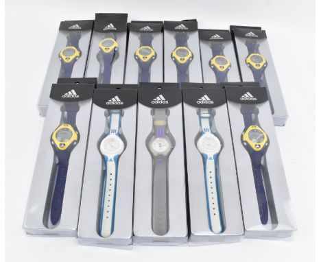 Adidas - a collection of eleven vintage 2003 digital wristwatches, boxed. Each wrist watch with plastic strap, various colour