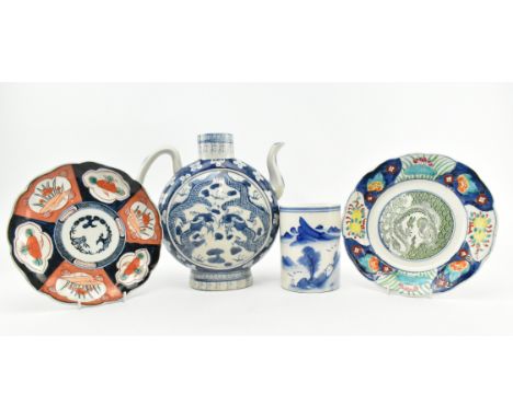 A collection of four 20th century Chinese and Japanese ceramic pieces. The lot comprising a Chinese blue and white ewer decor