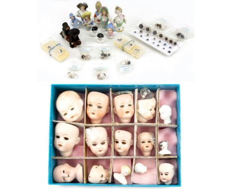 A COLLECTION OF CHINA DOLL'S HEADS to include many German stamped examples, Armand Marseille, Heuback etc with glass eyes, a 