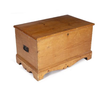 AN EARLY TO MID 20TH CENTURY PINE BLANKET BOX with twin wrought iron handles on a bracket base, 93cm wide x 56cm deep x 55cm 