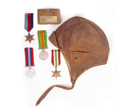 A SET OF FOUR WORLD WAR II MEDALS to include General Service medal, Defence medal, The Italy Star and The 1939-1945 Star, uni