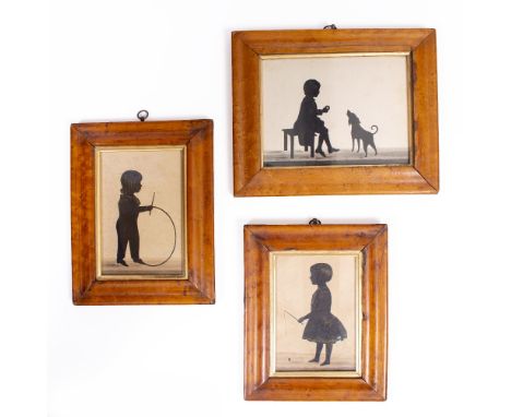 THREE 19TH CENTURY SILHOUETTES depicting children playing, all in maplewood frames, the largest 14cm x 19cm 