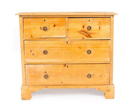 A LATE 19TH / EARLY 20TH CENTURY PINE CHEST OF TWO SHORT AND TWO LONG DRAWERS with brass ring handles and bracket feet, 86cm 